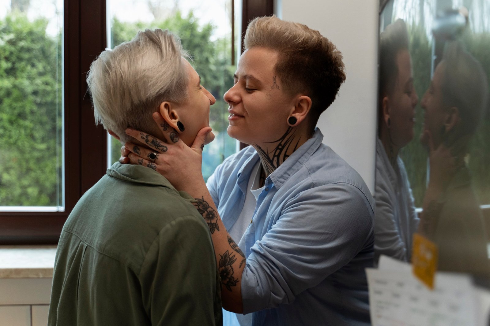 Two queer women sharing a romantic moment at home