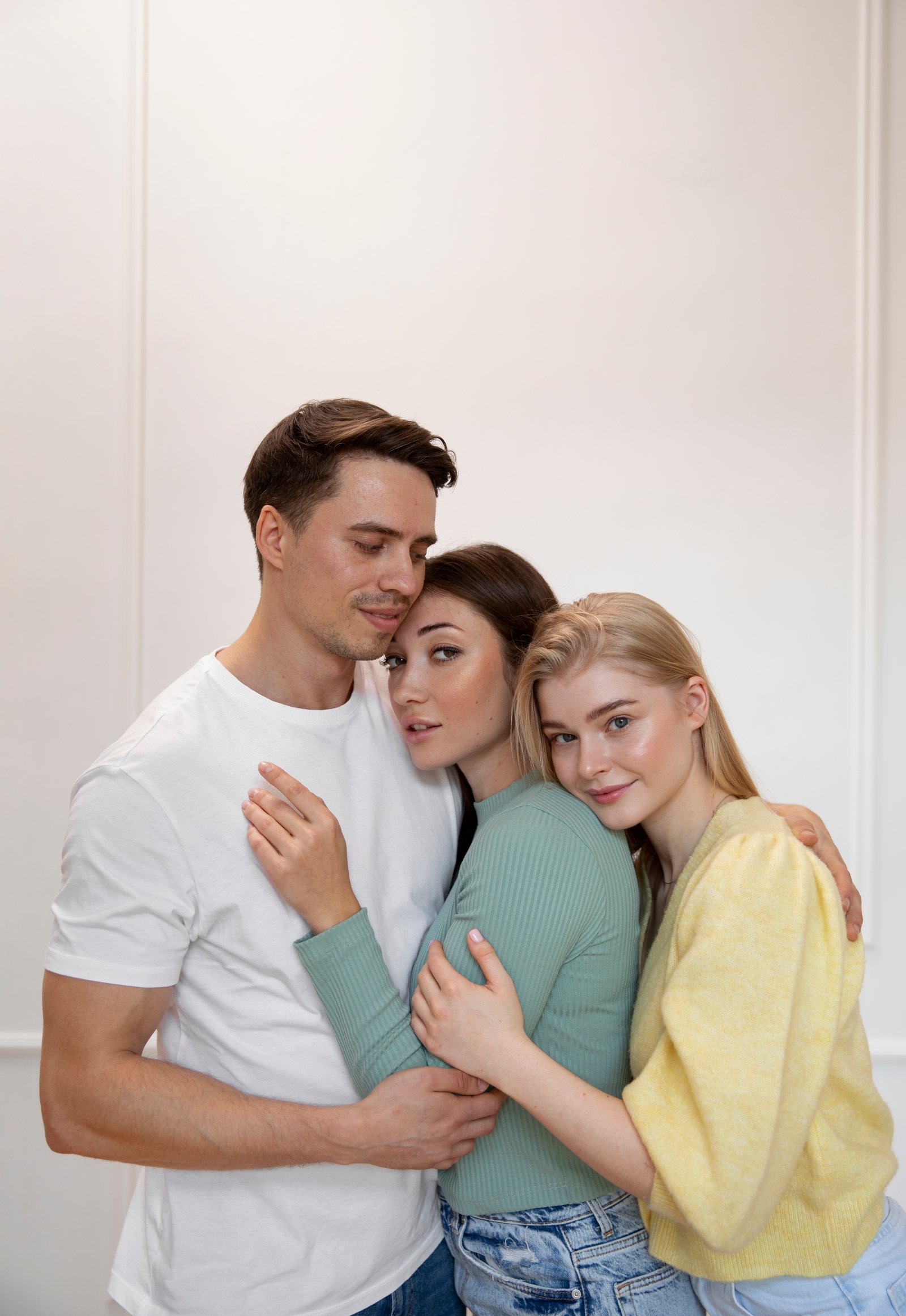 Three people embracing